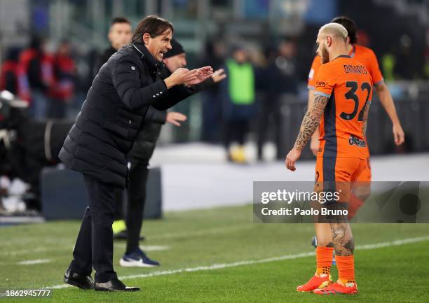 Simone Inzaghi speaks to Federico Dimarco of FC Internazionale during the Serie A TIM match between SS Lazio and FC Internazionale at Stadio Olimpico...