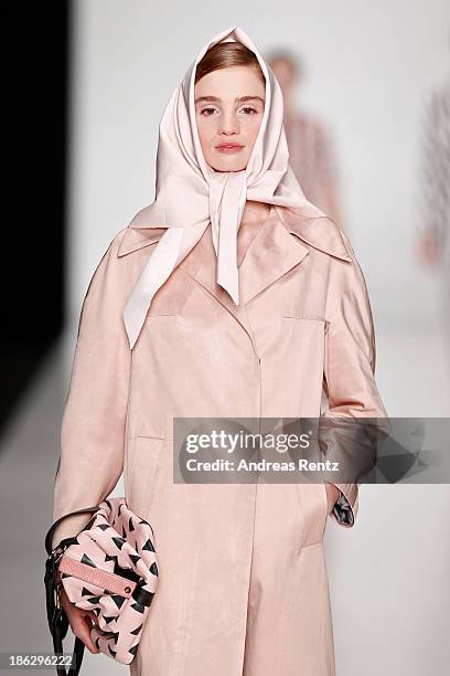 Model walks the runway at the Atelier Galetsky show during Mercedes-Benz Fashion Week Russia S/S 2014 on October 30, 2013 in Moscow, Russia.