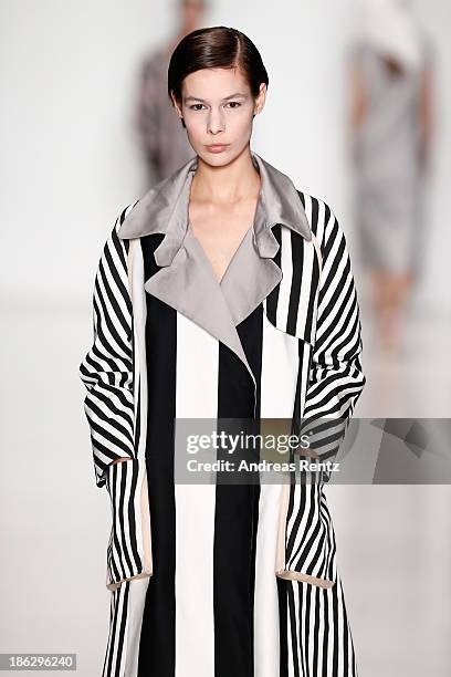 Model walks the runway at the Atelier Galetsky show during Mercedes-Benz Fashion Week Russia S/S 2014 on October 30, 2013 in Moscow, Russia.