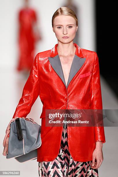 Model walks the runway at the Atelier Galetsky show during Mercedes-Benz Fashion Week Russia S/S 2014 on October 30, 2013 in Moscow, Russia.