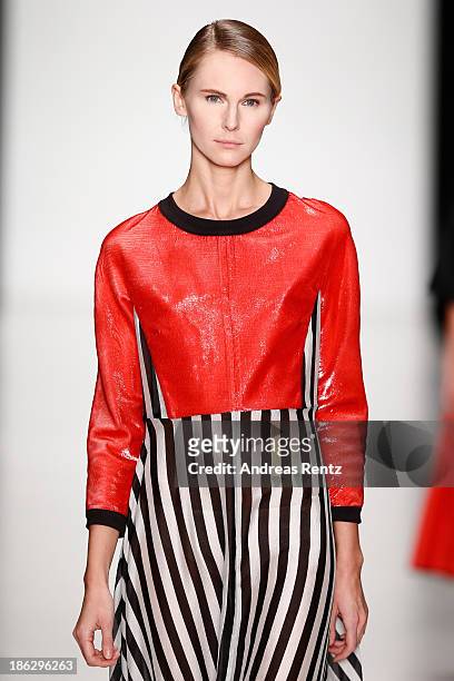 Model walks the runway at the Atelier Galetsky show during Mercedes-Benz Fashion Week Russia S/S 2014 on October 30, 2013 in Moscow, Russia.