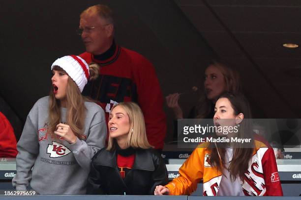 Taylor Swift, Scott Kingsley Swift, Ashley Avignone, Brittany Mahomes, and Alana Haim cheer while watching the Kansas City Chiefs play the New...