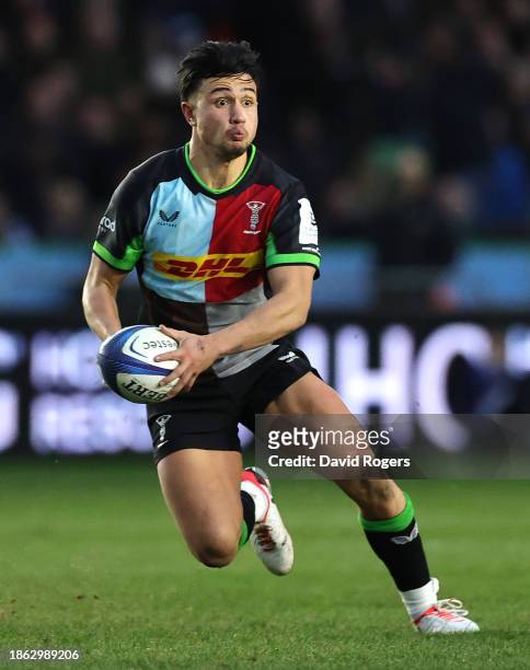 Marcus Smith of Harlequins runs with the ball during the Investec Champions Cup match between Harlequins and Stade Toulousain at Twickenham Stoop on...