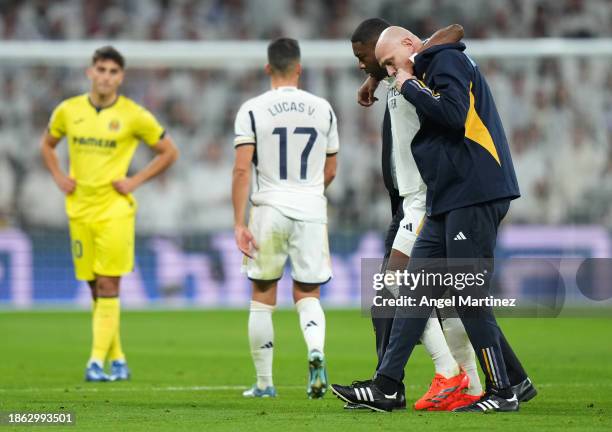 David Alaba of Real Madrid leaves the pitch after an injury during the LaLiga EA Sports match between Real Madrid CF and Villarreal CF at Estadio...