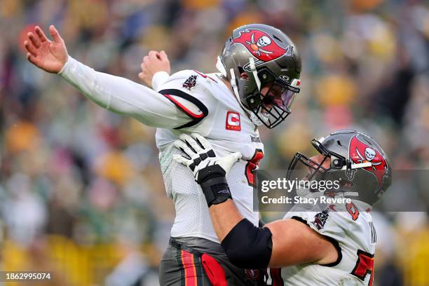 Baker Mayfield and Robert Hainsey both of the Tampa Bay Buccaneers celebrate after Mayfield's touchdown pass during the fourth quarter against the...