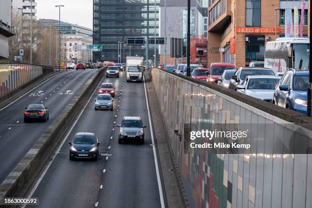 Cars in the 30mph Clean Air Zone run by Birmingham City Council along the A38 Bristol Street in the city centre on 14th December 2023 in Birmingham,...