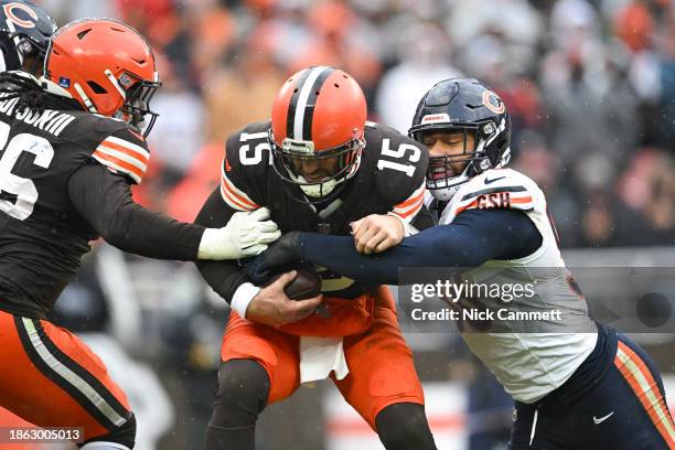 Montez Sweat of the Chicago Bears sacks Joe Flacco of the Cleveland Browns during the third quarter at Cleveland Browns Stadium on December 17, 2023...