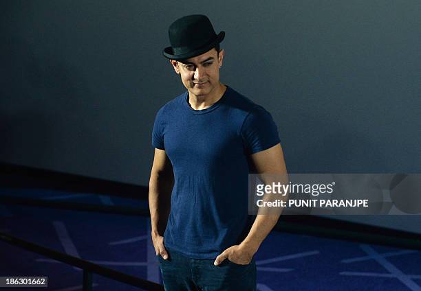 Bollywood fiolm actor Aamir Khan attends a news conference to announce the release of the first trailer of his new film 'Dhoom 3' in Mumbai on...