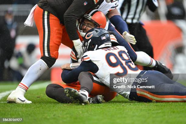 Joe Flacco of the Cleveland Browns is sacked by Montez Sweat of the Chicago Bears during the third quarter at Cleveland Browns Stadium on December...