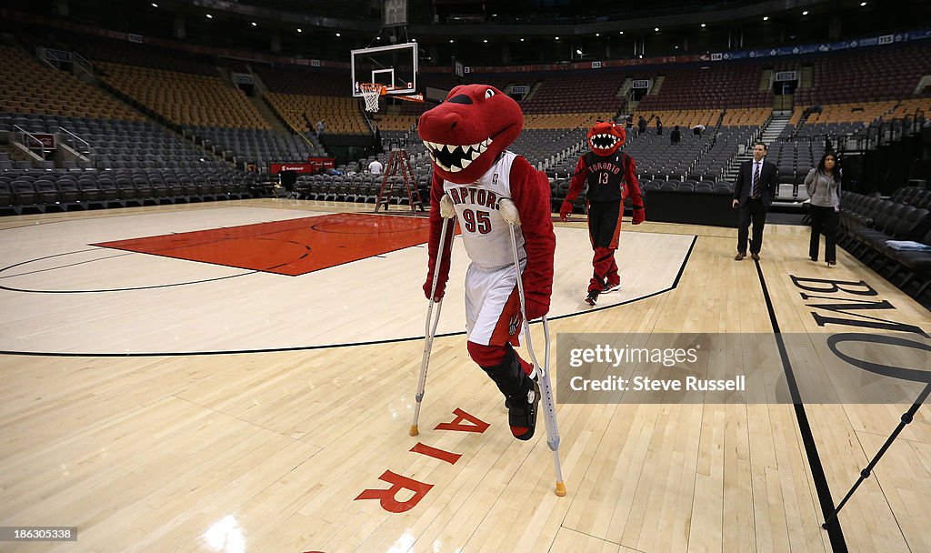 The Toronto Raptors mascot, The Raptor, helps his replacement,... News ...
