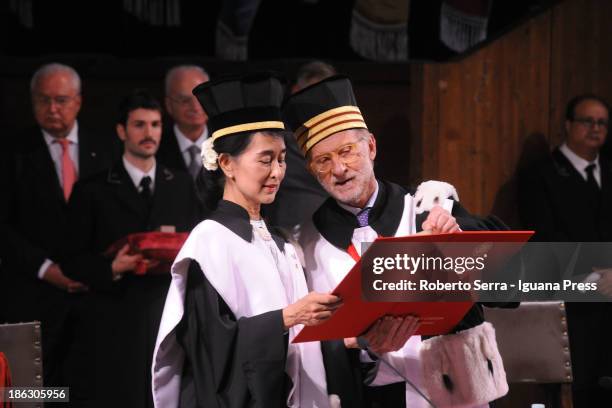 Nobel Peace Laureate Aung San Suu Kyi receives an honorary degree in philosophy from Ivano Dionigi, Rector of the University of Bologna, at Aula...