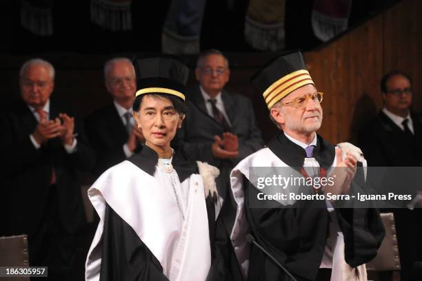 Nobel Peace Laureate Aung San Suu Kyi receives an honorary degree in philosophy from Ivano Dionigi, Rector of the University of Bologna, at Aula...