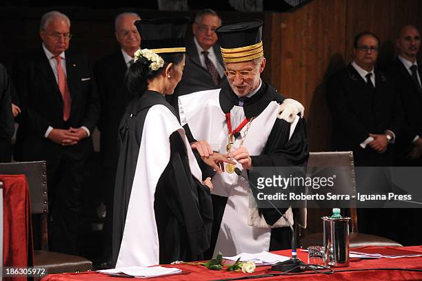 Nobel Peace Laureate Aung San Suu Kyi receives an honorary degree in philosophy from Ivano Dionigi, Rector of the University of Bologna, at Aula...