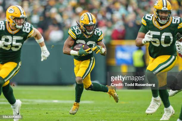 Running Back Aaron Jones of the Green Bay Packers runs with the ball during the second half of an NFL football game against the Tampa Bay Buccaneers...