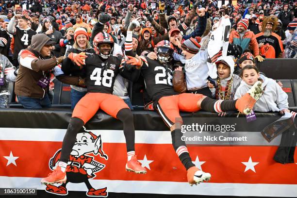 Tanner McCalister and Mike Ford of the Cleveland Browns celebrate after a fourth quarter interception to win 20-17 over the Chicago Bears at...