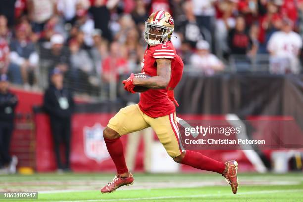 Charvarius Ward of the San Francisco 49ers runs back a interception 66-yards for a touchdown during the first quarter against the Arizona Cardinals...