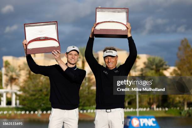 Bernhard Langer of Germany and son, Jason Langer, celebrate winning the PNC Championship at The Ritz-Carlton Golf Club on December 17, 2023 in...