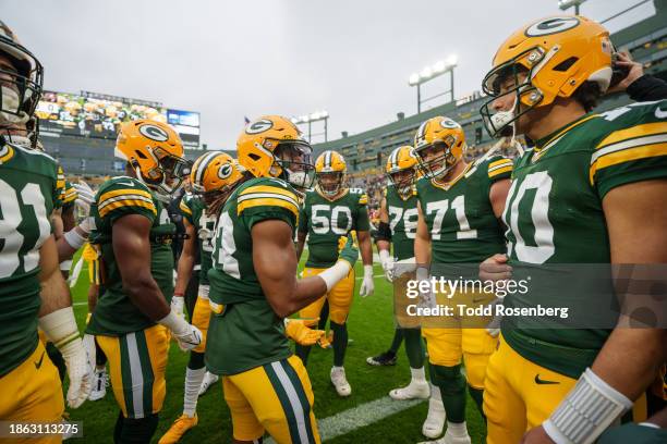 Running Back Aaron Jones of the Green Bay Packers motivates the team prior to an NFL football game against the Tampa Bay Buccaneers at Lambeau Field...