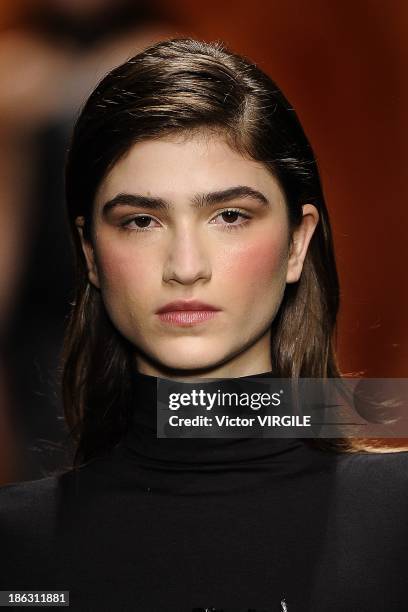 Model walks the runway during the Tufi Duek show at the Sao Paulo Fashion Week Winter 2014 on October 28, 2013 in Sao Paulo, Brazil.