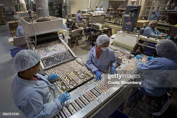 Workers sort "Necco Wafers" at the New England Confectionery Co. In Revere, Massachusetts, U.S., on Wednesday Oct. 23. 2013. The Institute for Supply...