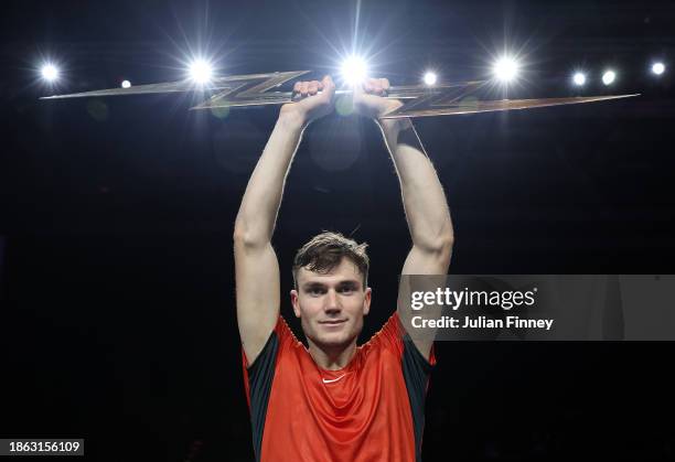 Jack 'The Power' Draper of Great Britain lifts the trophy after winning the Final match against Holger 'The Viking' Rune of Denmark during Day Three...