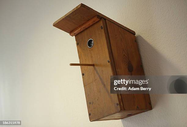 Birdhouse with a hidden camera inside hangs on display at the Stasi , or East German Secret Police Museum, on October 30, 2013 in Berlin, Germany....