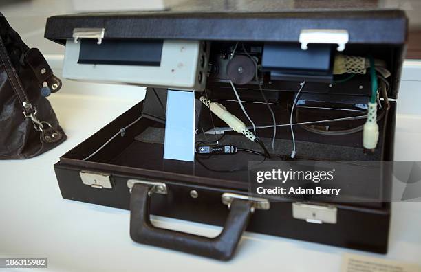 Briefcase hiding infrared camera flashes for taking discreet photographs at night is displayed at the Stasi , or East German Secret Police Museum, on...