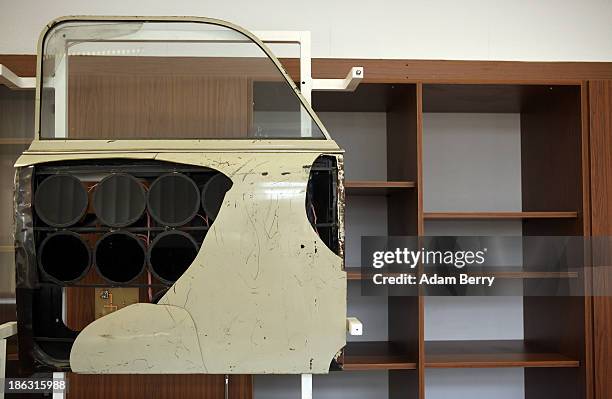 The door of an East German Trabant automobile holding hidden infrared camera flashes for taking discreet photographs at night is displayed at the...