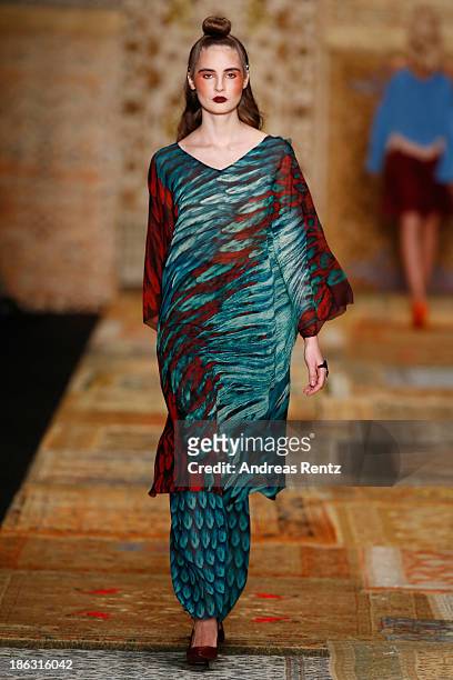 Model walks the runway at the Alena Akhmadullina show during Mercedes-Benz Fashion Week Russia S/S 2014 on October 30, 2013 in Moscow, Russia.