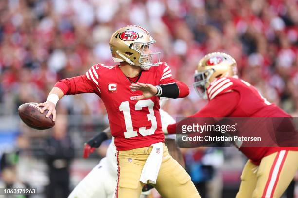 Brock Purdy of the San Francisco 49ers throws a pass during the first half of a game against the Arizona Cardinals at State Farm Stadium on December...