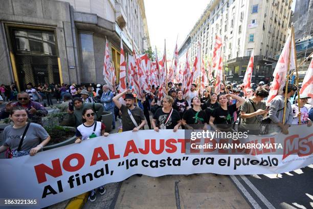 Members of the Workers' Socialist Movement protest and partially block a street during the first demonstration against the new government of Javier...