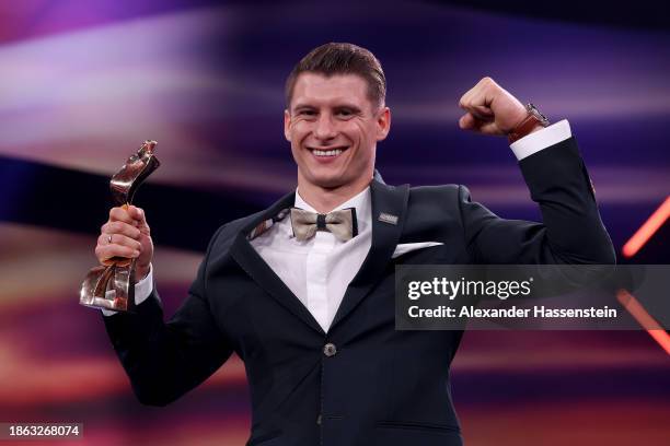 Lukas Dauser poses with this "Sportler des Jahres" Award 2023 at Kurhaus Baden-Baden on December 17, 2023 in Baden-Baden, Germany.