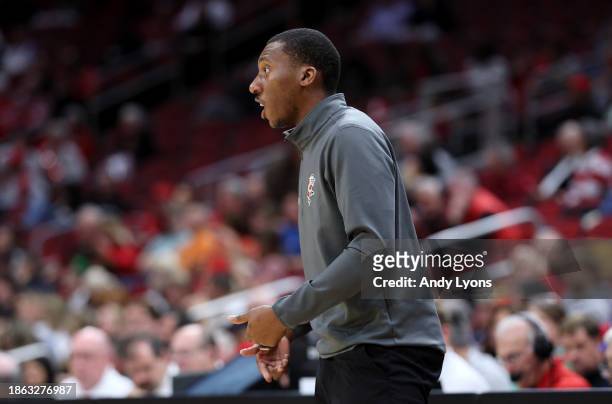 Nolan Smith the assistant head coach of the Louisville Cardinals watches the action against the Pepperdine Waves at KFC YUM! Center on December 17,...