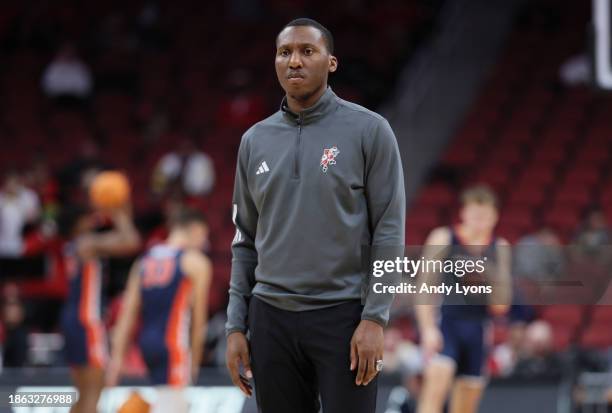 Nolan Smith the assistant head coach of the Louisville Cardinals watches the action against the Pepperdine Waves at KFC YUM! Center on December 17,...