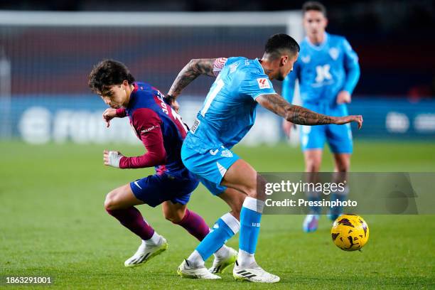 Joao Felix of FC Barcelona and Chumi of UD Almeria during the La Liga EA Sports match between FC Barcelona and UD Almeria played at Lluis Companys...