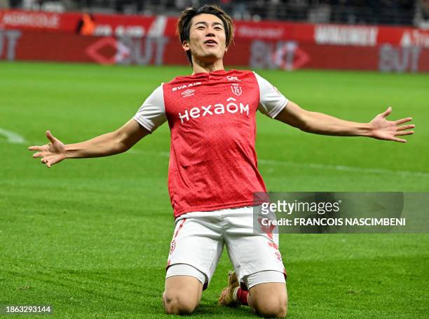 Reims' Japanese forward Keito Nakamura celebrates after opening the scoring during the French L1 football match between Stade de Reims and Le Havre...
