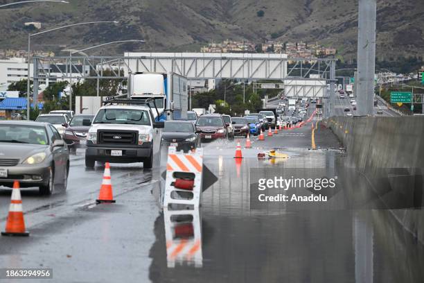 Left lane is closed as cars commute on Highway 101 near the San Francisco International Airport as heavy rain hits in South San Francisco,...