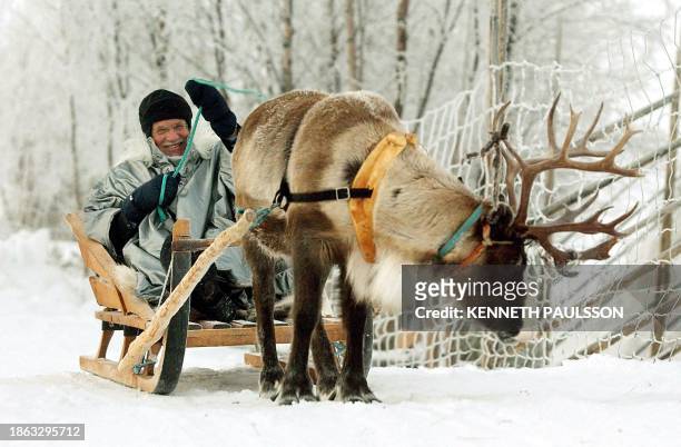 Czech President Vaclav Klaus rides a reindeer sleigh during his visit in Jukkasjaervi, in northern Sweden, 03 December 2003. Klaus also visited the...