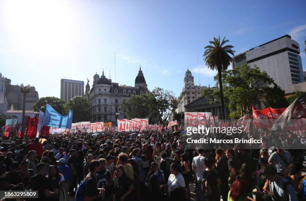 People gather during a demonstration against President Javier Milei and recent announcements by Minister of Economy Luis Caputo on December 20, 2023...