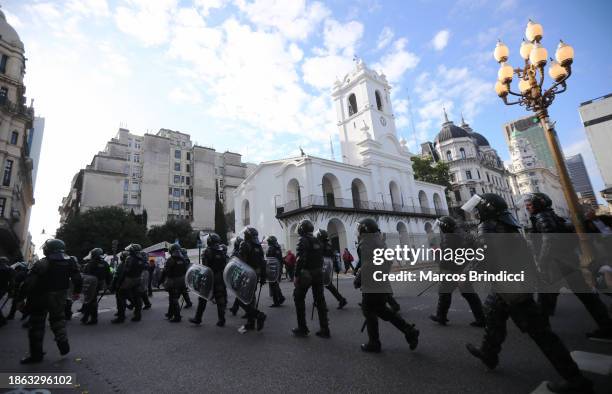 Police officers patrol during a demonstration against President Javier Milei and recent announcements by Minister of Economy Luis Caputo on December...