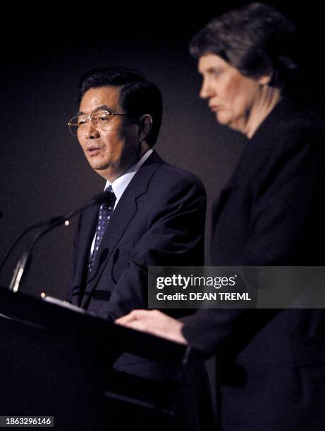 Chinese President Hu Jintao and New Zealand Prime Minister Helen Clark address the media during a press conference after their bilateral talks at the...