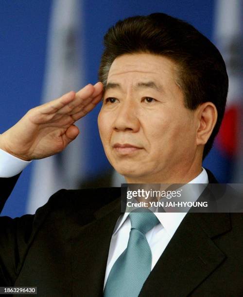 South Korean President Roh Moo-hyun salutes his soldiers during the 55th Armed Forces Day ceremony at the Sungnam military airport in outskirts of...