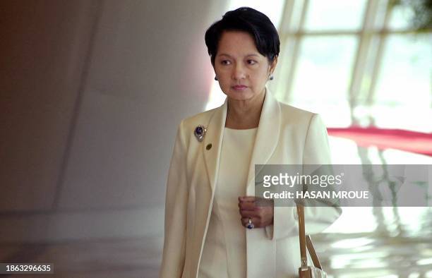Philippines President Gloria Arroyo arrives at Putrajaya's convention center to observe the opening of the10th summit of the Organization of the...