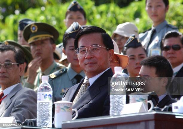 Taiwan President Chen Shui-bian watches the island's biggest ever wargame held in Litzechien, northeastern Ilan county, 04 September 2003. At least...