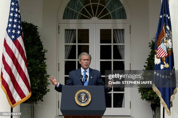 President George W. Bush holds a press conference in the Rose Garden of the White House 30 July, 2003 in Washington, DC. This is his ninth formal,...