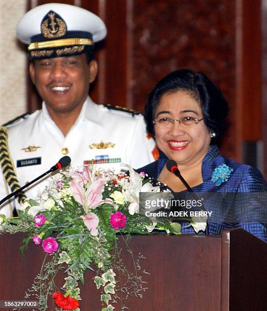 Indonesian President Megawati Sukarnoputri smiles before addressing her speech during the opening of the 5th Asia and Europe Foreign Ministers...