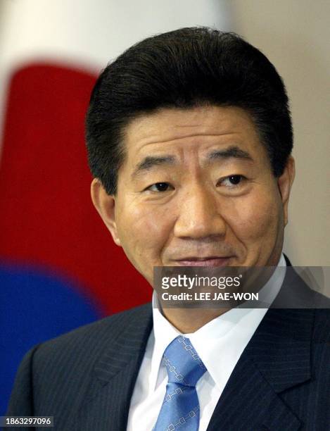 South Korean President Roh Moo-Hyun listens during a press conference at the Presidential Blue House in Seoul, 21 July 2003. Roh, 21 July, played...