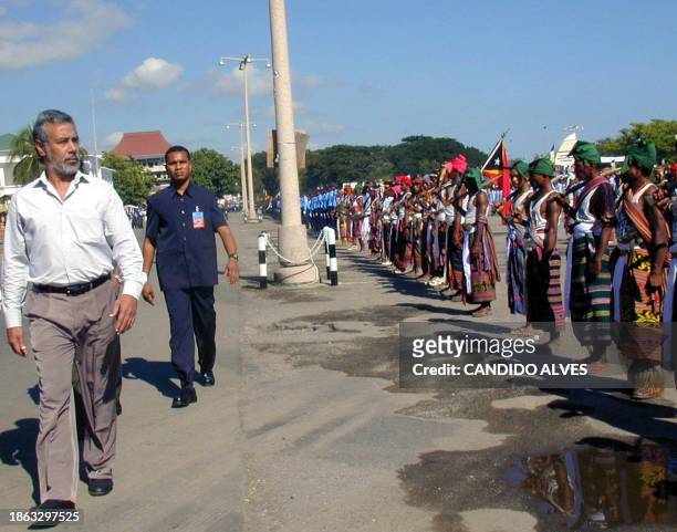 East Timor President Xanana Gusmao inspects Timoreses in traditional dress during an independence anniversary ceremony in Dili, 20 May 2003. East...