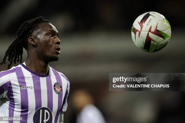 Toulouse's Dutch forward Ibrahim Cissoko eyes the ball during the French L1 football match between Toulouse FC and Monaco AS at the TFC Stadium in...