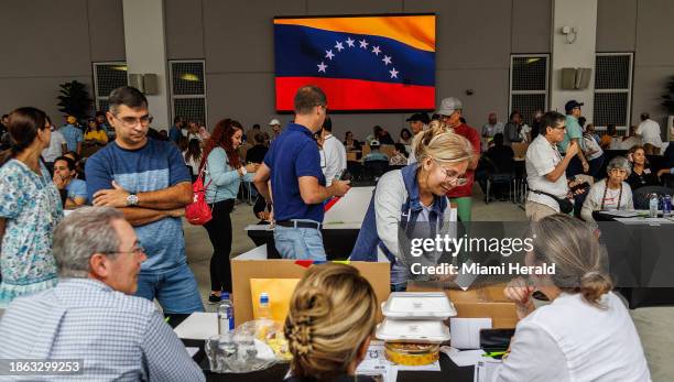 Venezuelans vote in the primary elections to chose the opposition candidate for next year's presidential election at the Miami Dade College West...